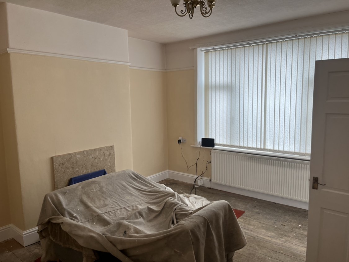 Living room fully stripped back, re-plastered and redecorated in a warm neutral scheme — the same whole-room refresh offered across Southport PR8 and PR9