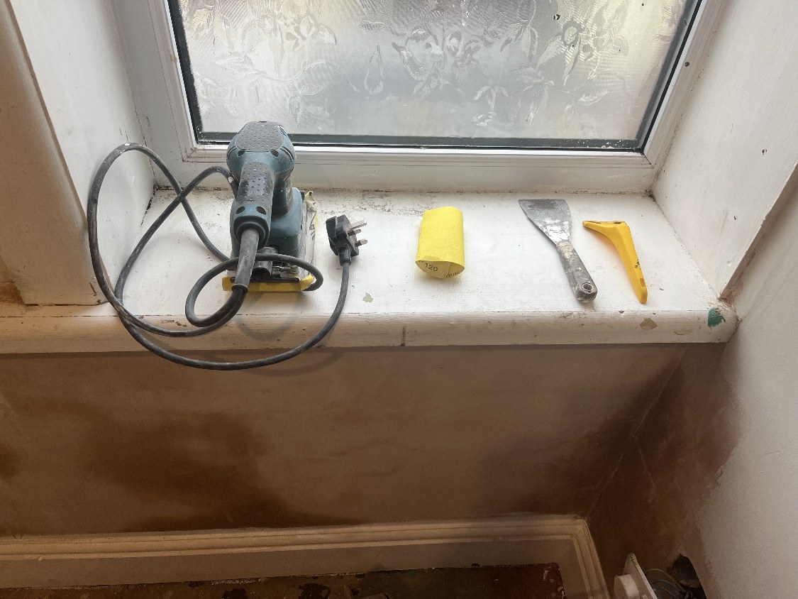 Damaged interior window cill before restoration, sanding, filling and repainting — the woodwork preparation Southport coastal properties need most