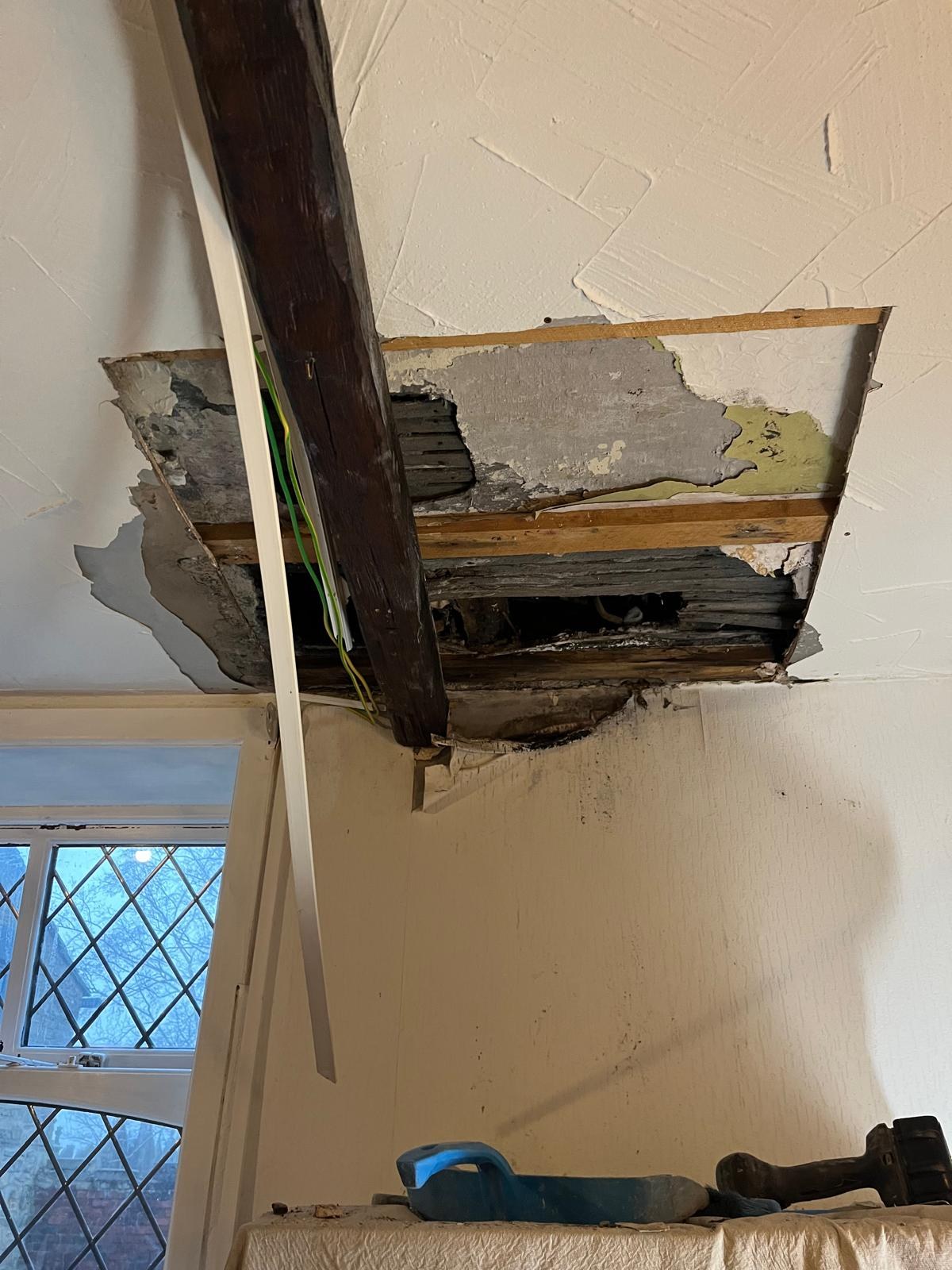 Lath and plaster ceiling repair in progress with exposed original timber beams — the same period ceiling plastering carried out for Southport and Birkdale villas
