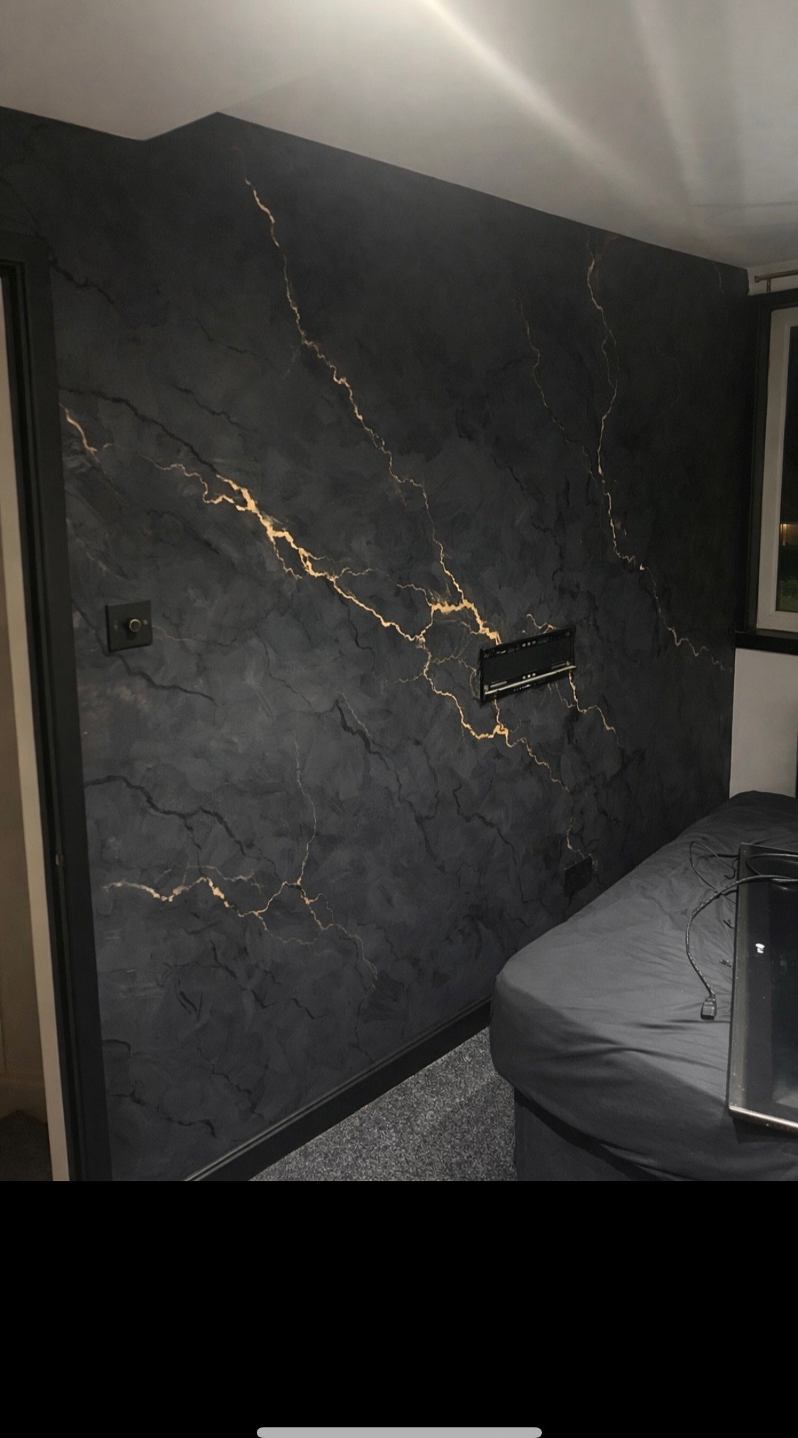 Black marble effect feature wall with hand-applied metallic gold veining — the specialist feature wall finish offered to Southport and Birkdale homeowners