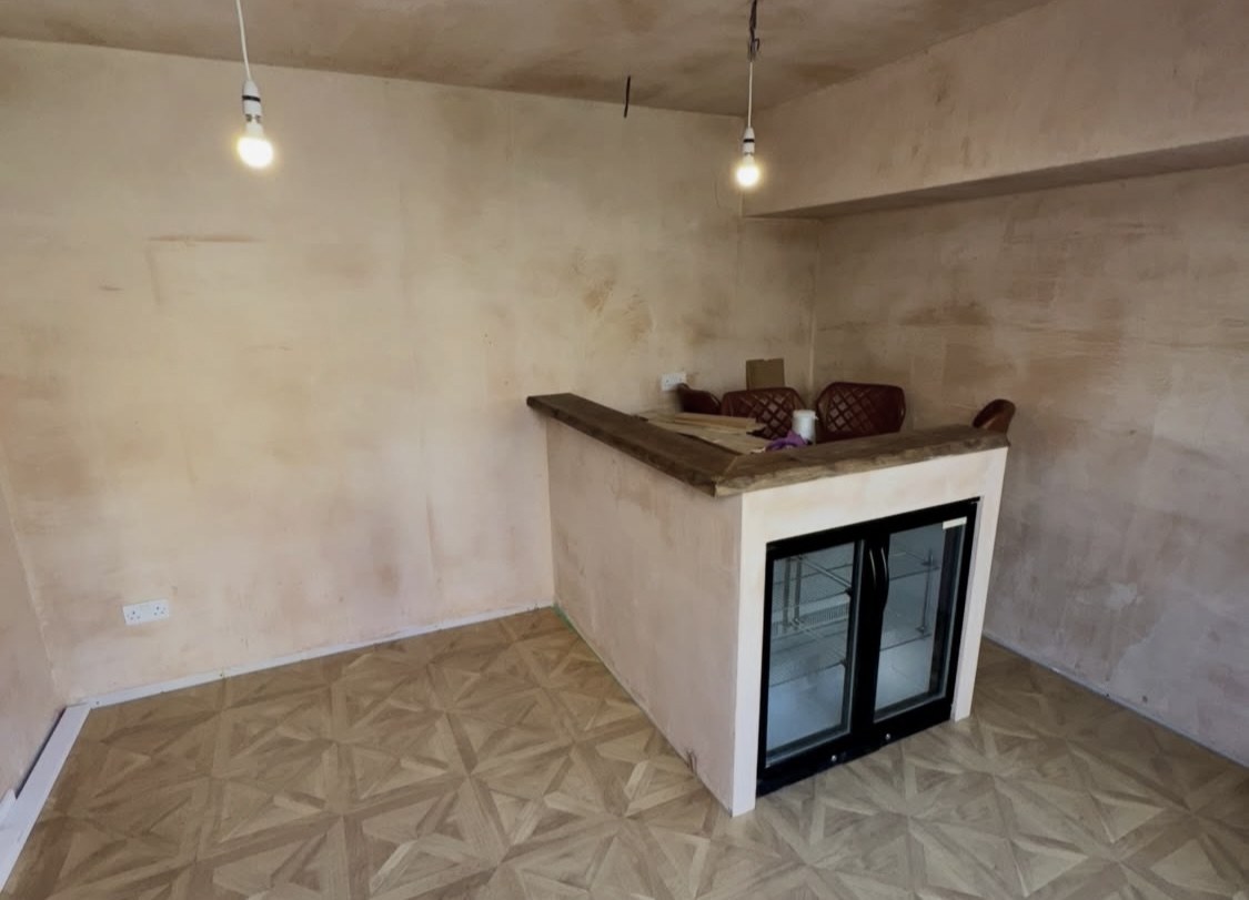 Home bar fully skim plastered across walls and ceiling ready for decoration — the same skimming service for Southport garden bars and snugs
