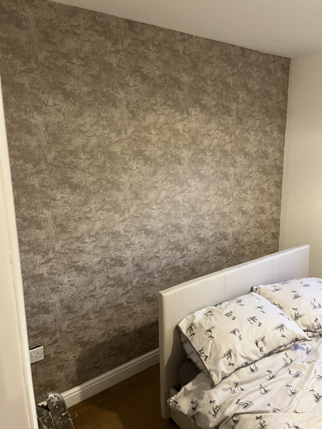 Contemporary concrete effect wallpaper feature wall with matched seams — the same feature wall installation available in Ainsdale, Churchtown and Formby
